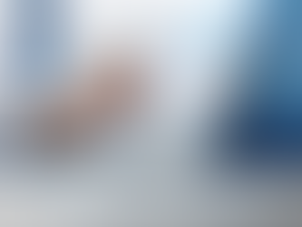 Healthcare administrator reviewing a patient communication workflow on a tablet in a modern medical office