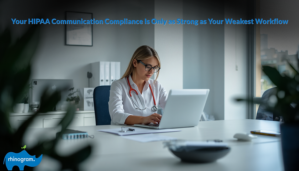 Healthcare compliance administrator reviewing HIPAA communication compliance documentation on a laptop at a clean modern office workstation