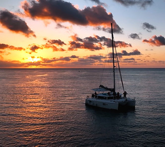 a boat in Oahu at sunset