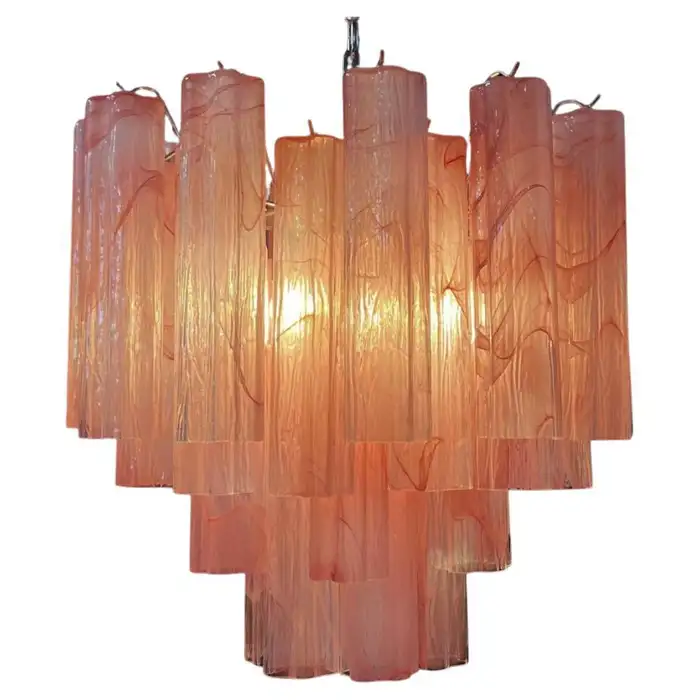 Pink Murano tube glass chandelier with warm glowing light.