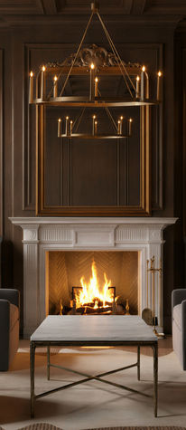 Gentlemen’s lounge with dark wood paneling, a white marble fireplace, brass chandelier and marble coffee table.