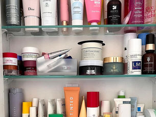 Organised skincare shelf with cleansers, moisturisers, serums and everyday beauty essentials neatly arranged.