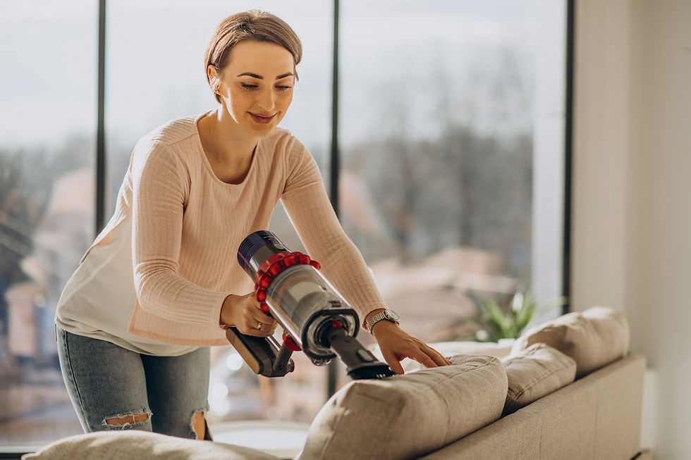 young-woman-with-rechargeable-vacuum-cleaner-cleaning-home.jpg