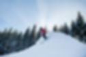 full-length-shot-woman-skiing-mountains.jpg