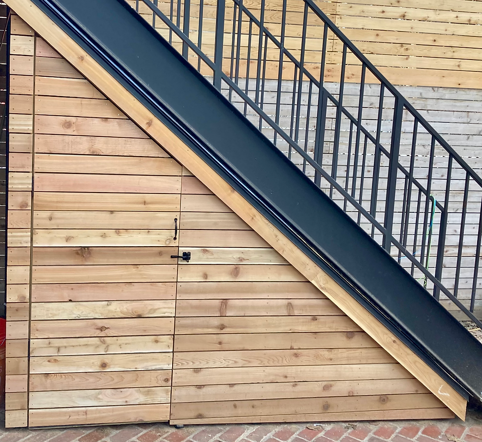 A custom cedar storage enclosure help maximize space in a small backyard garden 