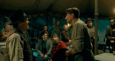 A group of "carnies" partying in a tent (Nightmare Alley movie).