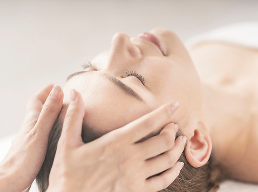 young-woman-having-her-head-massaged-at-