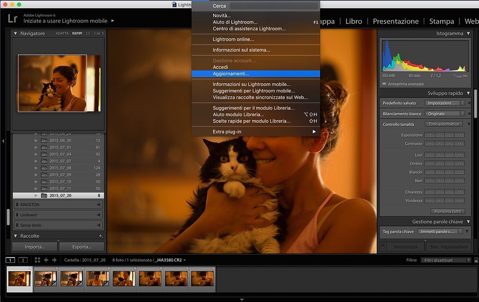 la finestra di lightroom aperta su una foto con una ragazza che tiene in braccio un gatto e la selezione della voce Aggiornamenti sul menù Aiuto
