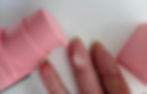 One punp of BYOMA De-Puff and Brighton Eye gel on a finger with a white background