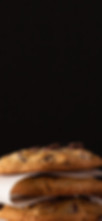 stack of four chocolate chip cookies
