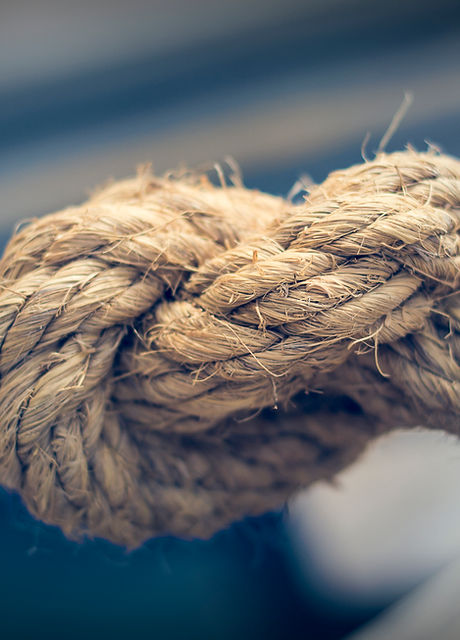 Close up textured photo of a knotted rope