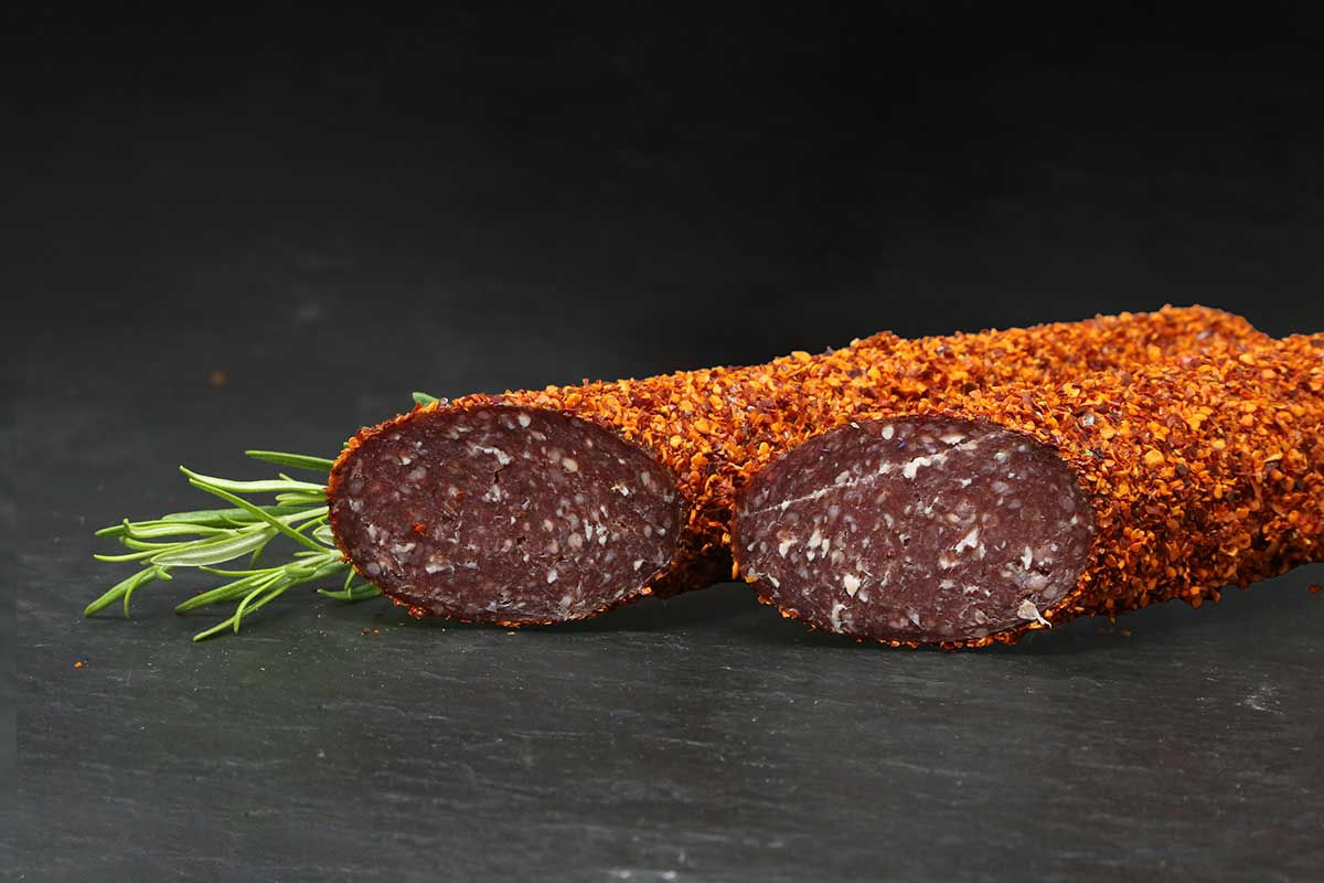 Krösbacher Rundsalami met chilipeperlaag