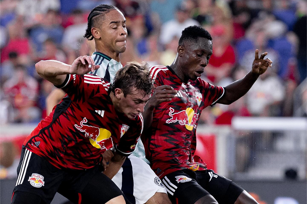 Daniel Edelman and Ronald Donkor battling for the ball during an MLS league match between the New York Red Bulls and New England Revolution at Sports Illustrated Stadium