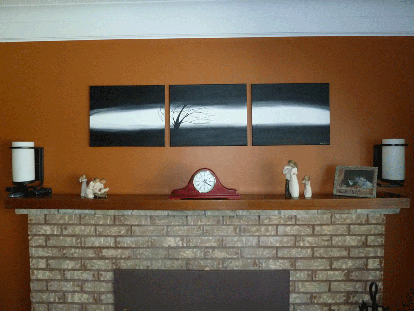 Custom triptych tree painting in black and white over fireplace