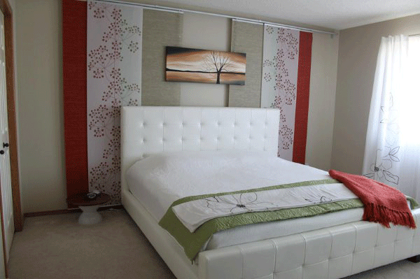 Beautiful bedroom design with custom tree painting by Kelly Anne Bedford