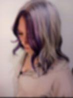 A client with a purple money piece and silver hair