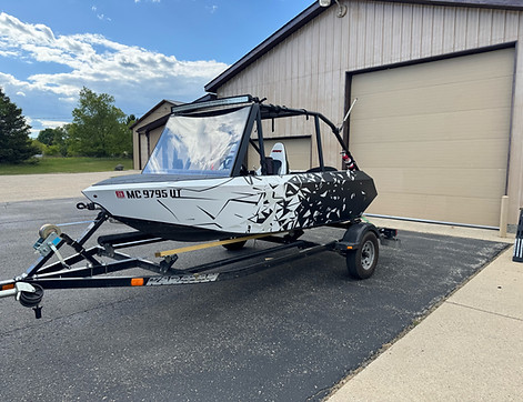 A shattered Glass wrap on a boat. Produced by Epicenter Graphics, Benzonia Mi