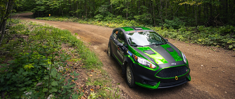 Full custom wrap on a Ford Fiesta Rally Car wrap- 3m Matte Black + Green Chrome by Epicenter Graphics, Benzonia MI