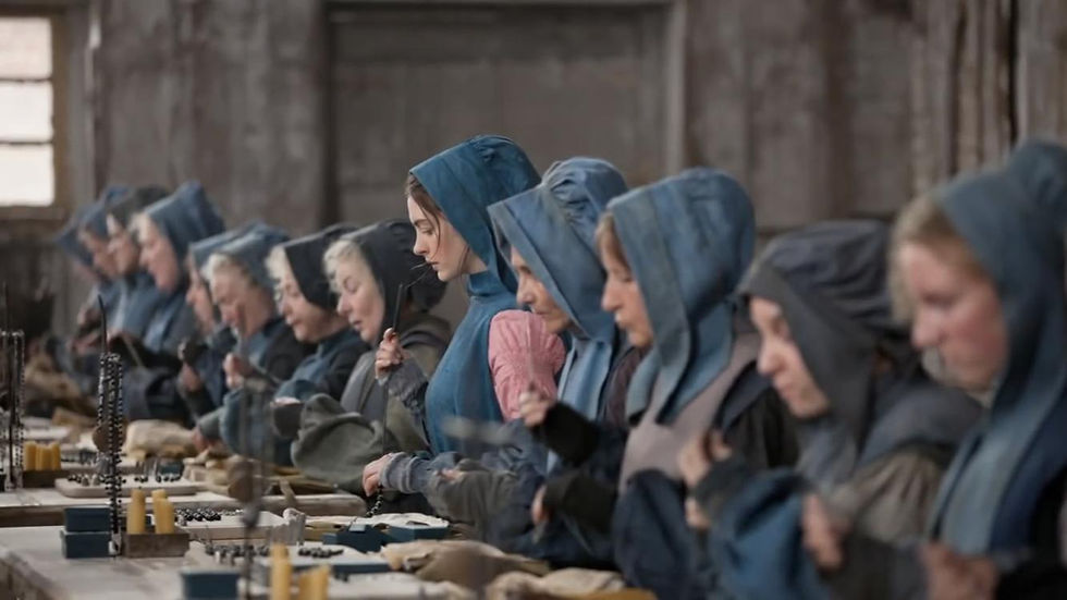 People working in factory from the motion picture Les Miserables (2012)