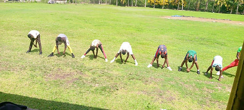 Cricket Intervention Programme Jamaica (CIP) - Merlene Ottey High Students exercising on cricket pitch