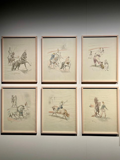 A collection of six framed equestrian-themed drawings displayed on a gallery wall. Each artwork features scenes of horses and riders, rendered in delicate pencil and soft colors, showcasing action, elegance, and artistic detail.