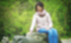 woman-sitting-on-stone