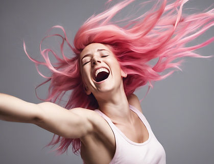young white woman with pink hair throwing her head back so her hair flows around like she