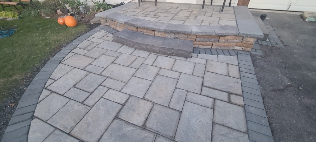 Gray paver patio and curved steps overview