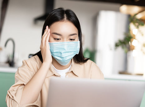 young-sick-asian-girl-medical-face-mask-using-laptop-working-from-home-quarantine.jpg