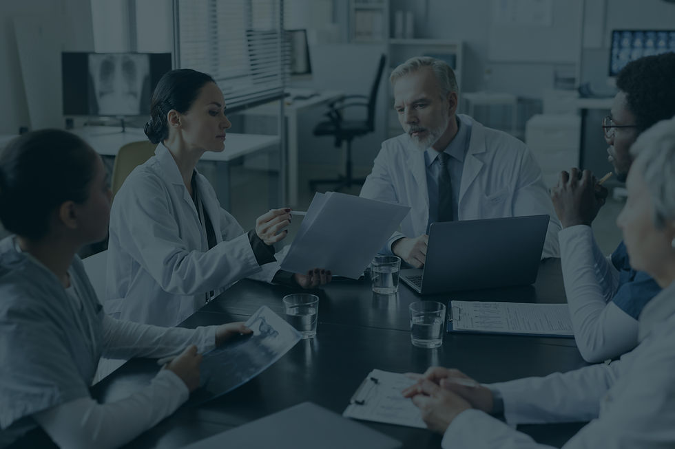 young-female-clinician-showing-medical-documents-experienced-doctor copy.jpg