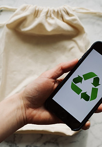 faceless-person-showing-recycle-symbol-o