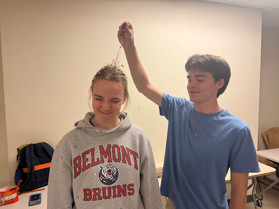 New Follie Luke Anderson smashing a confetti-filled egg on top of Follies director Mia Vrablic's head. (Abby Thomas)