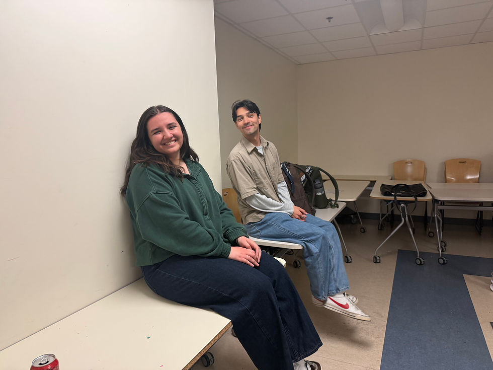 New Follie Claire Kennedy and senior Follie Jacob Vasquez taking a break from rehearsal. (Abby Thomas)