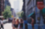 Five people on a New York City street with the Twin Towers