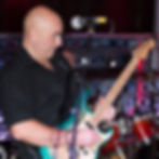 Man playing electric guitar on stage