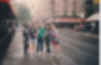 Five people on a wet city street