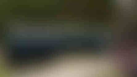 Male choir singing outside church