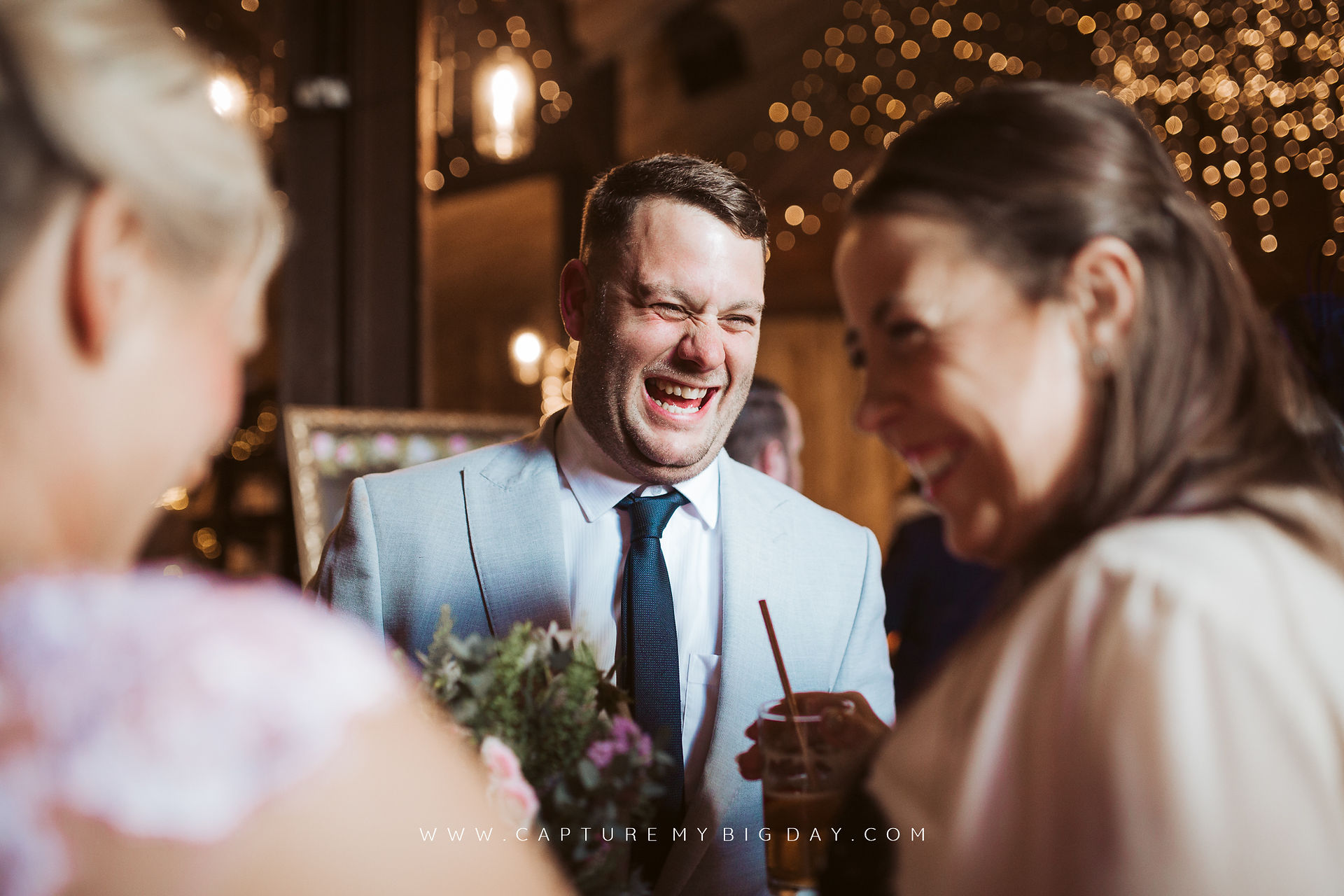 wedding guest laughing