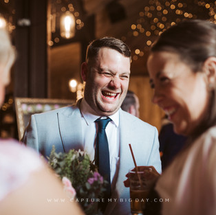 wedding guest laughing