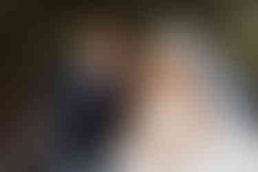 Bride and groom sharing a moment on the boat