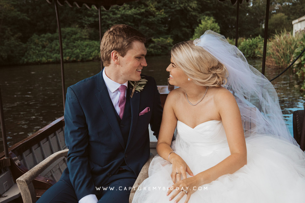 Bride and groom sharing a moment on the boat