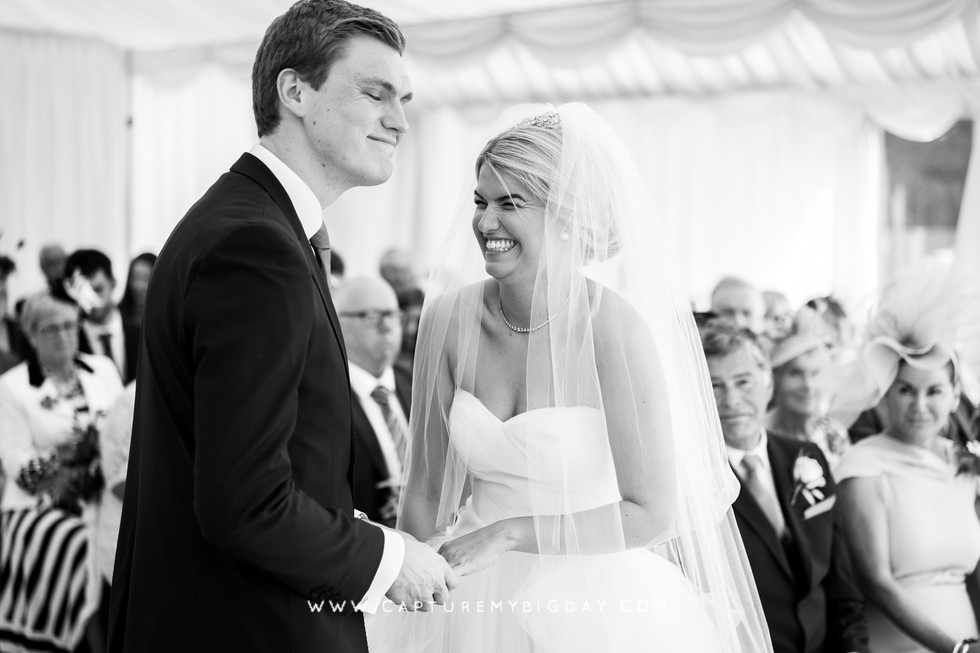 bride laughing at wedding vows