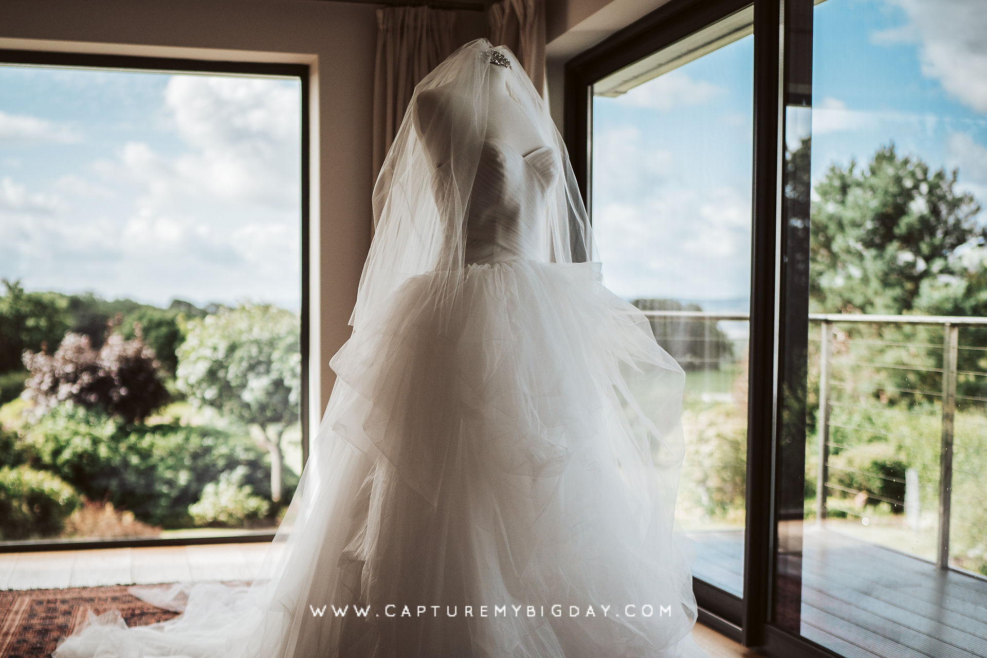 White wedding dress on stand