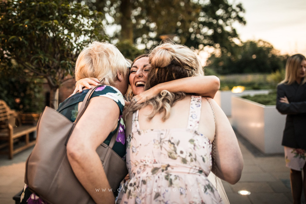 bride hugging guests
