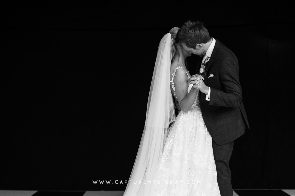 bride and groom dancing