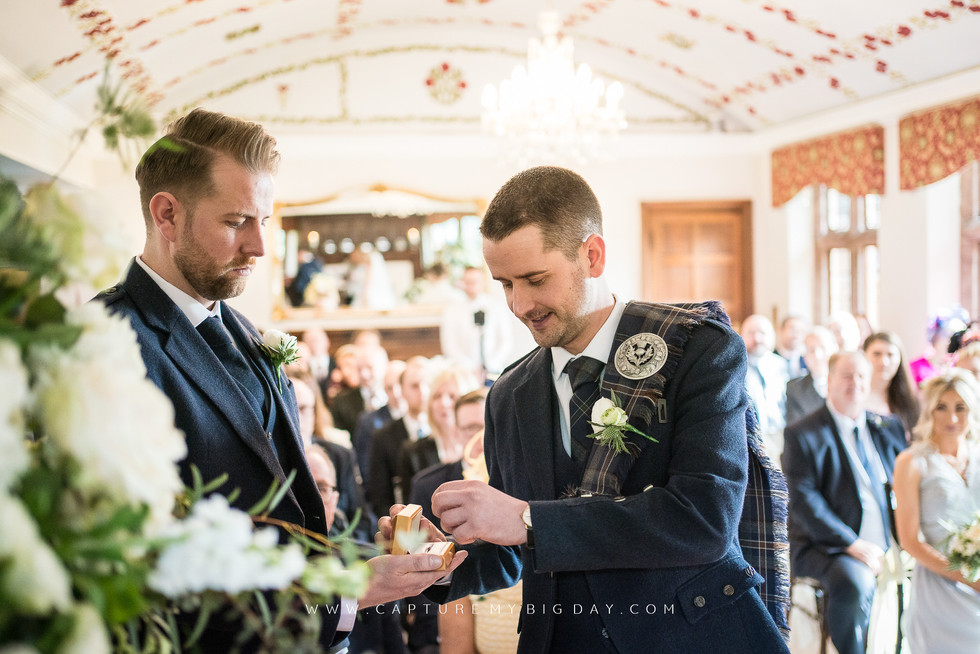 groom collecting ring in ceremony