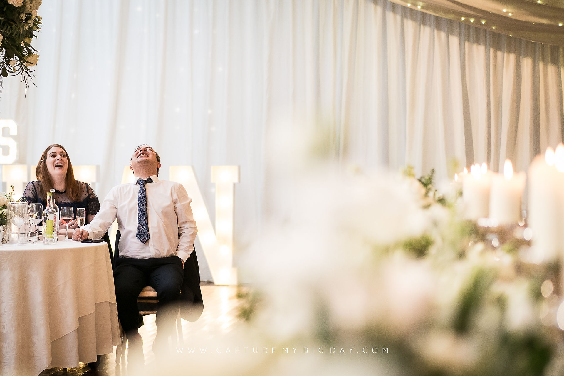 wedding guests laughing