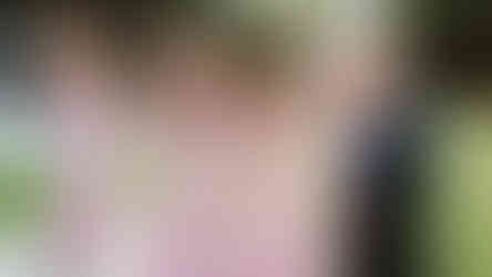 Bridesmaids with brides parents laughing