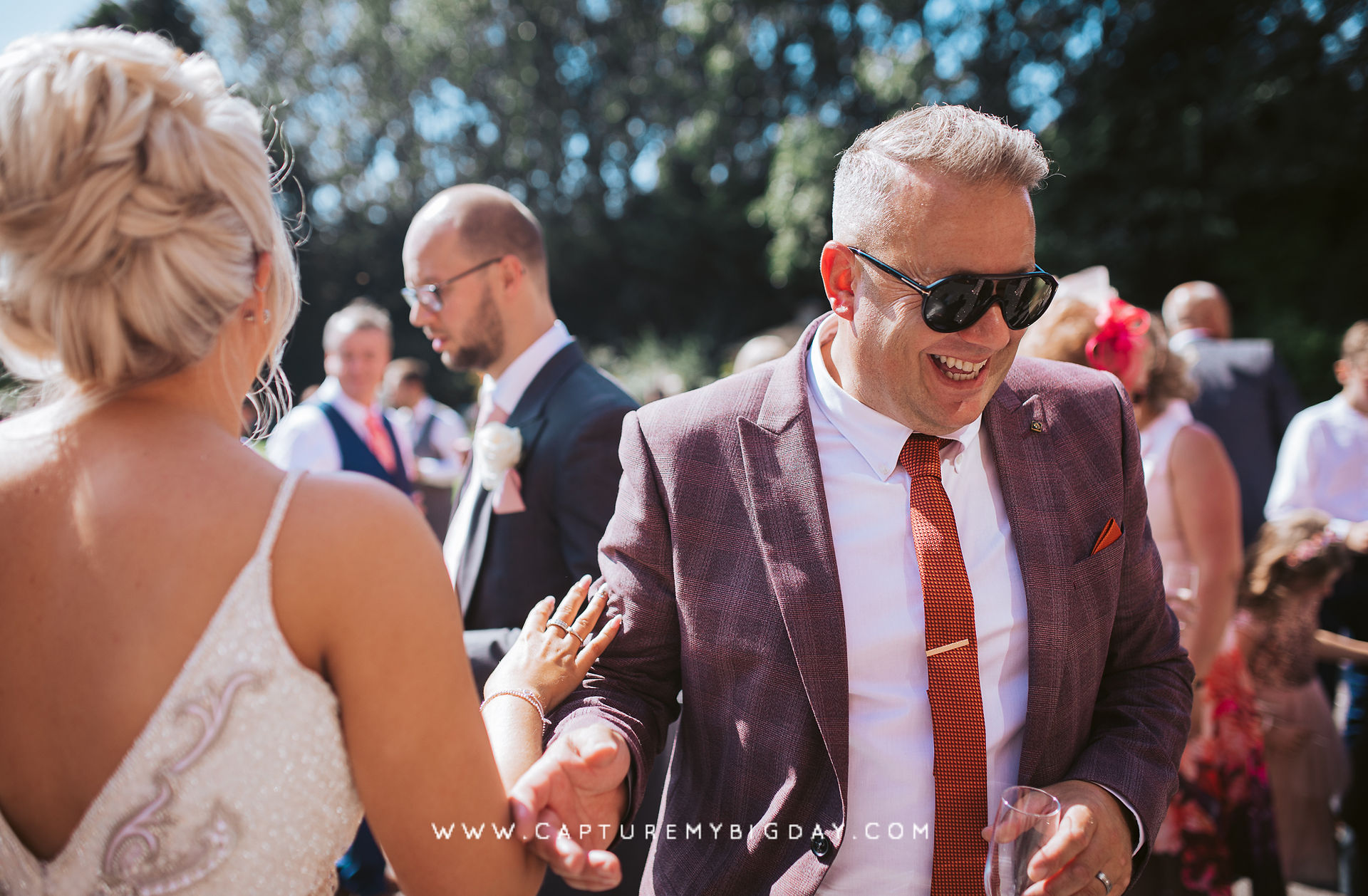 wedding guest laughing