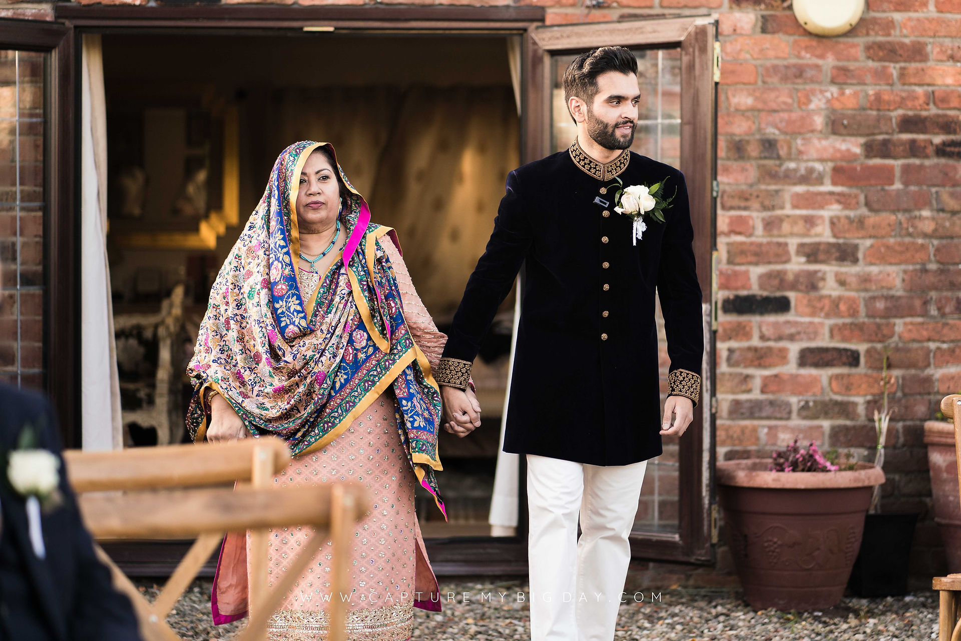 Groom walking with his mother